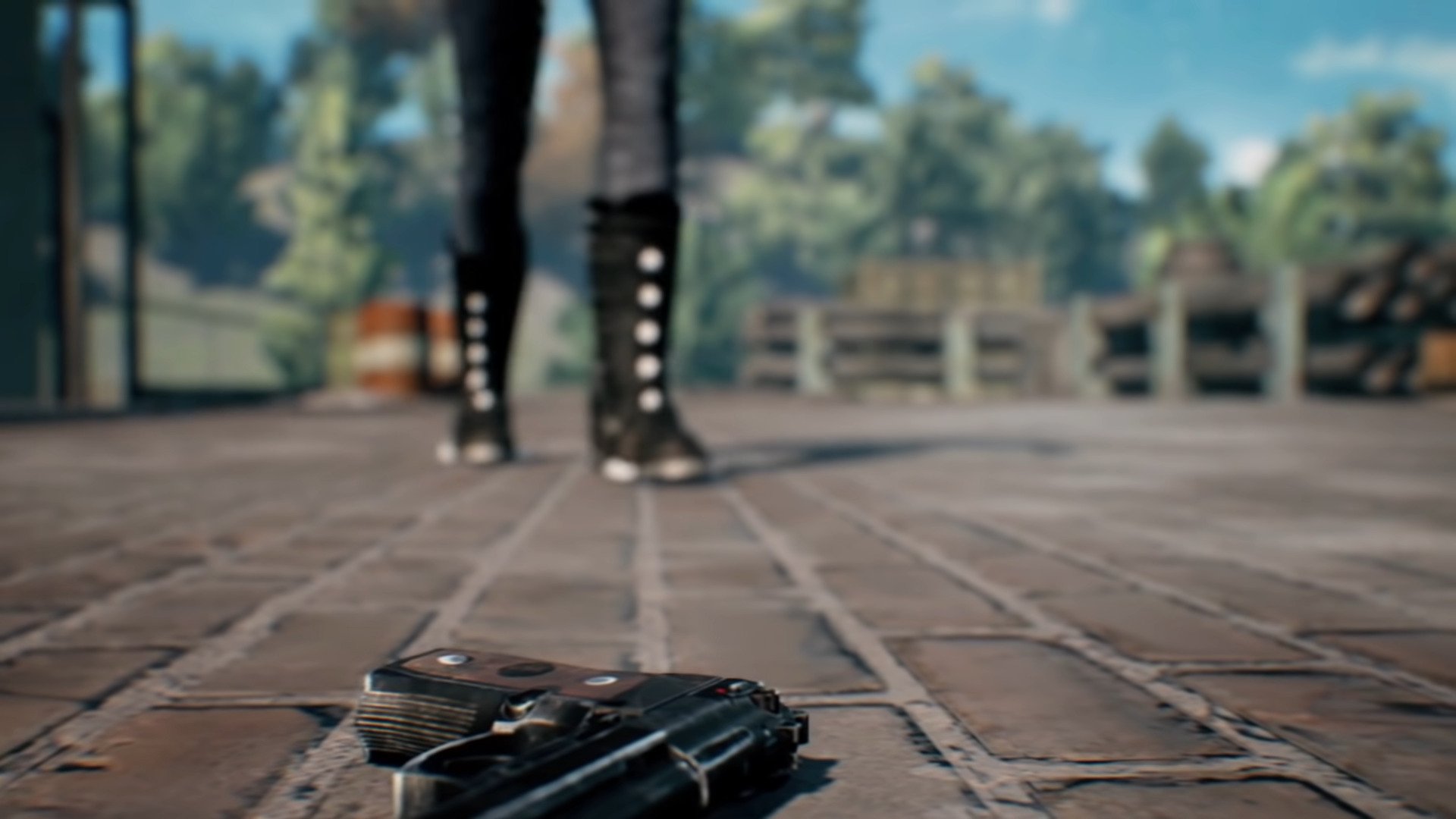 Shoes standing in front of a gun on the floor in PUBG Mobile