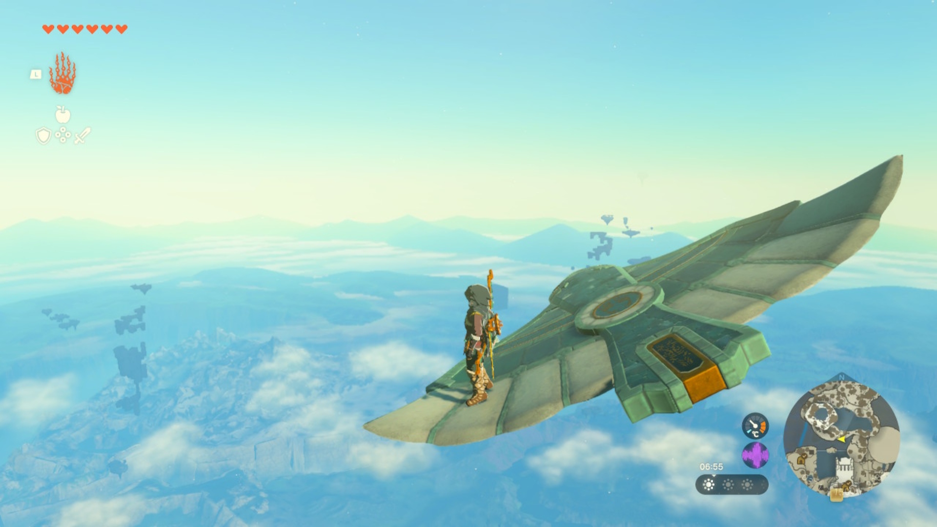 Link turning a Zonai wing glider to the left by standing on its left wing in The Legend of Zelda: Tears of the Kingdom