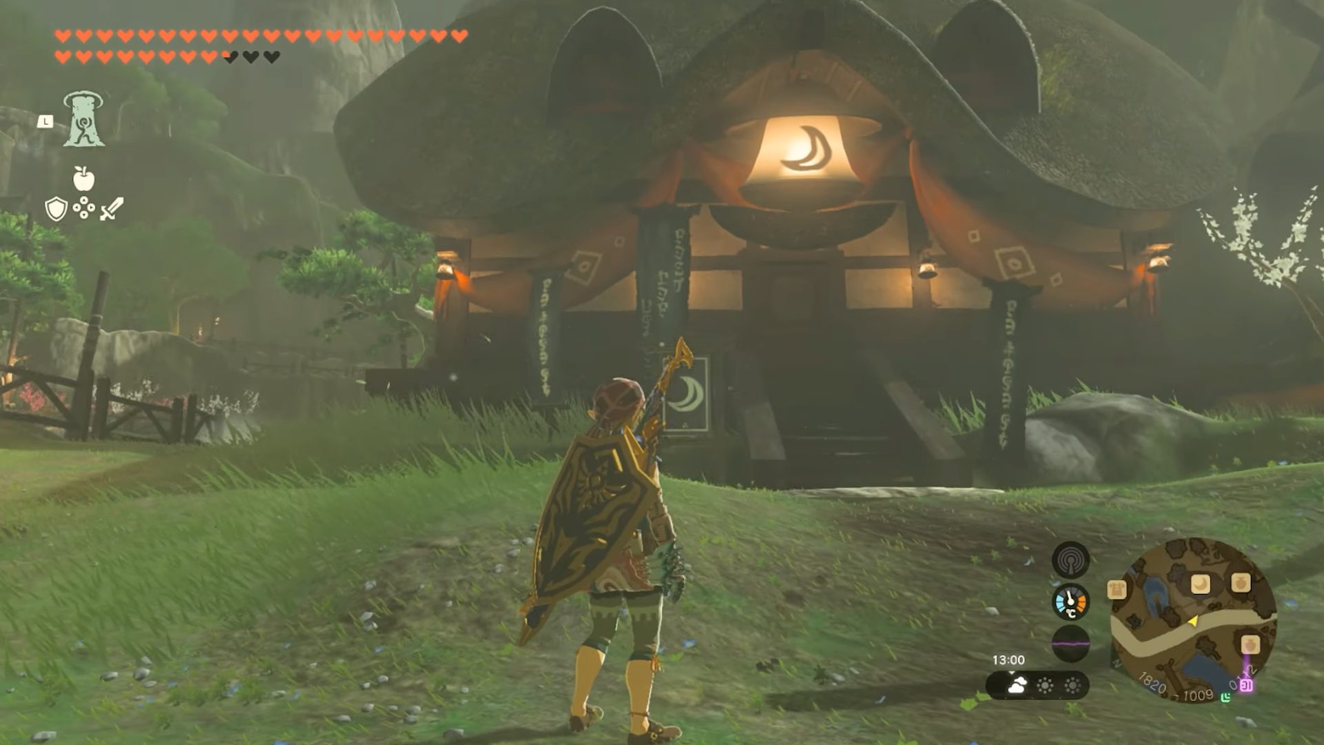 Link stood in front of Kakariko Village Inn